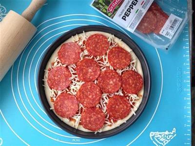 Pepperoni pizza made of iron